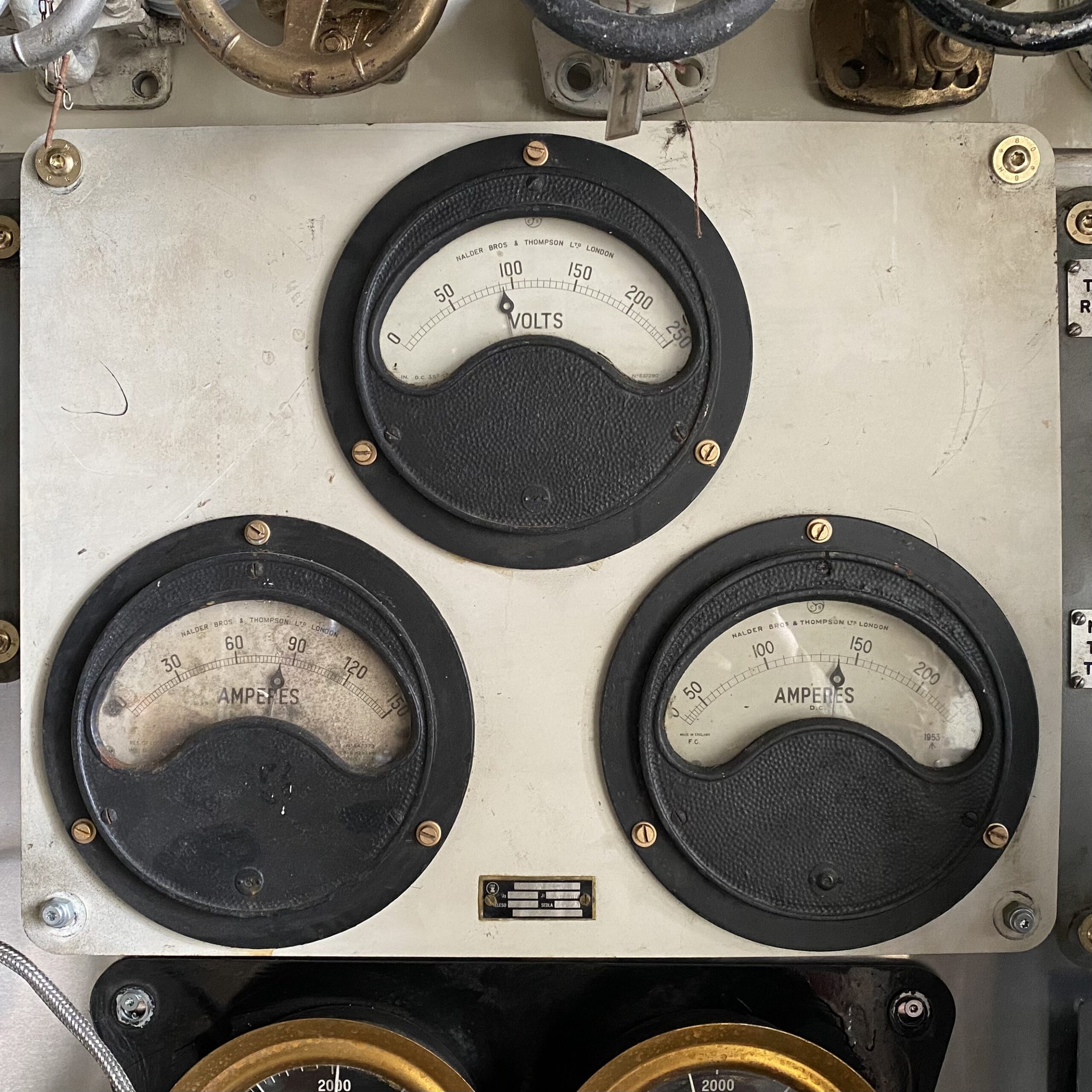 Three mounted naval dials